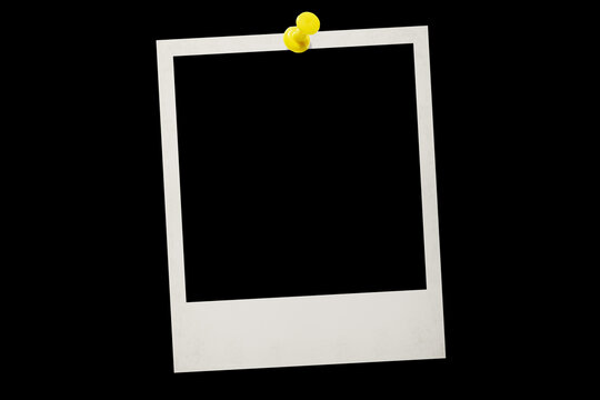 Photo card attached with a push pin isolated on a black background.