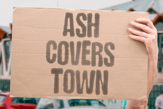 "Ash Covers Town" The streets wear a gray coat. Volcano eruption warning. Roofs groan under the weight. Power lines sag and snap. The town looks like a ghost.