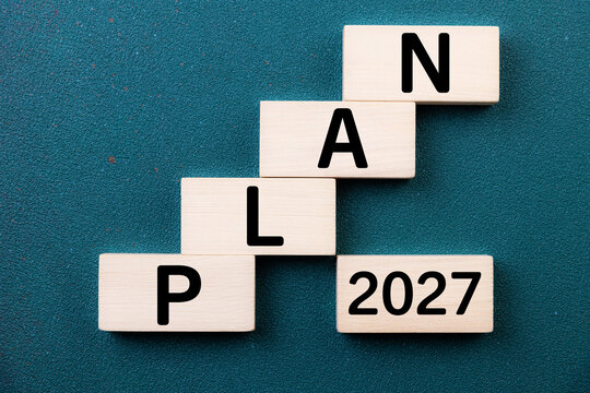 2027 New Year card. New Years goals 2027 with wooden cube, target icon. Concept 2027 New Year background. Goal, plan, action, business, resolutions,  financial, success, ideas