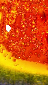 Burning Movie Film Close-Up. Macro view of film bubbling, boiling and igniting as heat destroys the surface with glowing orange and red textures.