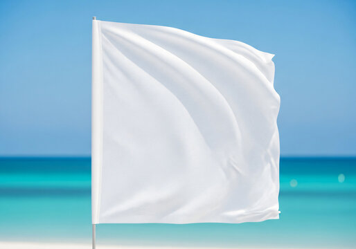 Blank white flag fluttering on a sunny day at the tropical beach