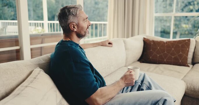 Relax, thinking and man in house with coffee, calm mindset and daydreaming on weekend break. Reflection, nostalgia and mature person with warm drink, mindfulness and peaceful perspective in lounge.