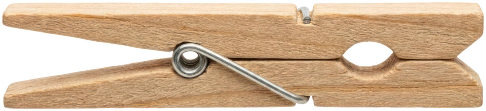 Classic wooden spring clothespin on dark background.