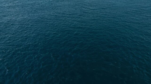 Aerial view of deep blue sea water at Pantai Watudodol in Kecamatan Kalipuro, Jawa Timur, Indonesia.
