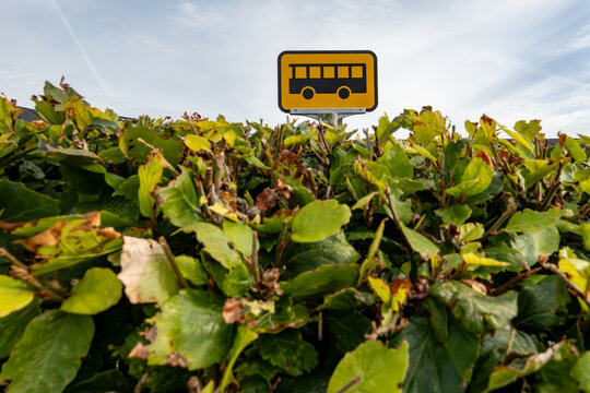 Hjorring, Denmark A small yellow sign for a bus stop in the besuhes.