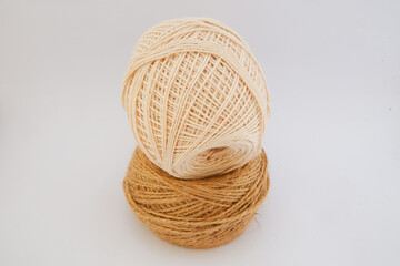The neatly wound cotton thread creates an intricate textured pattern. This simple craft material is...