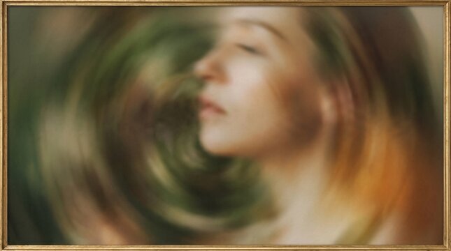 A serene woman's profile with closed eyes, surrounded by a swirling, dreamlike vortex of blurred earthy tones, evoking a sense of introspection and calm.