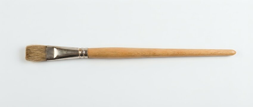 Flat lay of a single artist paintbrush with natural bristles