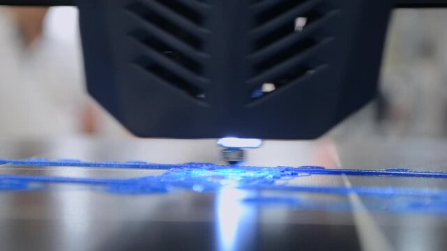 Process printing on 3D printer. The 3D printing process from molten plastic blue color. 3D printing technology. FDM technologies. Fused Deposition Modeling. Additive manufacturing.