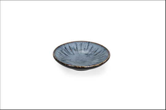 shallow, handcrafted ceramic dish or saucer featuring a reactive crystalline glaze with soft oceanic blue-green and earthy tones.