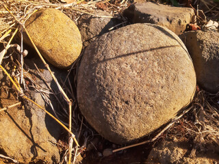 Natural Round Stones on Dry Ground © Dani