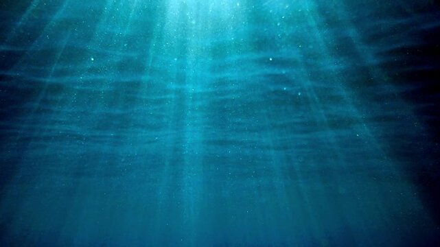 Slow motion of Abstract underwater sea with soft blue light and calm water currents, peaceful serenity. Blue flare light beam. Underwater background of ocean with sunlight rays. Real video. undersea.