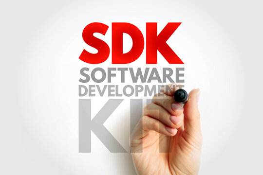 SDK Software Development Kit acronym written by hand with marker. Technology term representing tools, libraries, and documentation for creating applications and systems