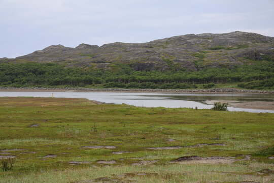 Mountain landscape showing Norwegian and Russian wilderness separated by the Jakobselv River near the border.