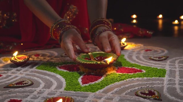 Clay diya lamps lit during diwali celebration, Diwali, or Deepavali, is India's biggest and most important holiday.
