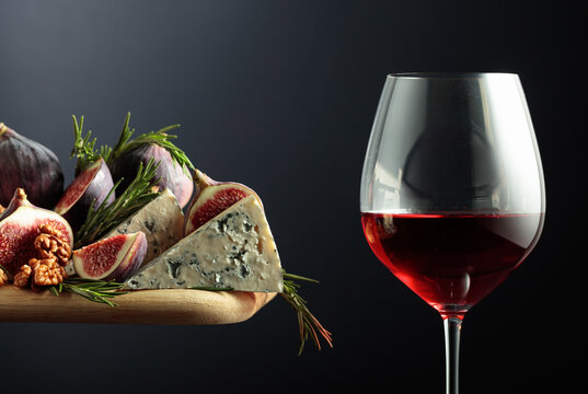 Red wine with blue cheese, figs, walnuts, and rosemary.