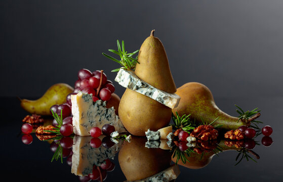 Blue cheese with pear, walnuts, red grapes, and rosemary.