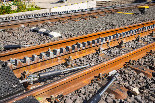 Detailed view of a cogwheel railway track with a toothed rack in the center, designed for steep mountain ascents