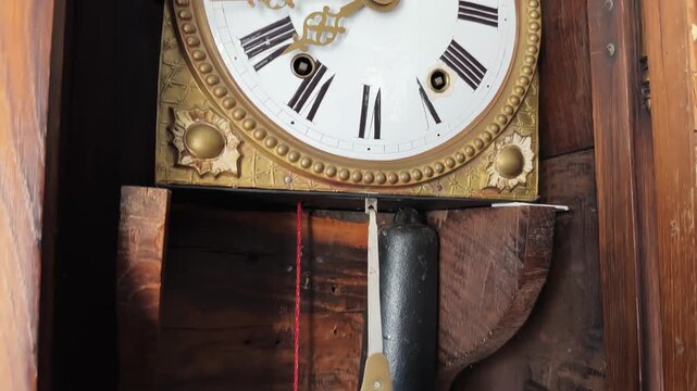 Antique longcase floor clock in wooden case with open door