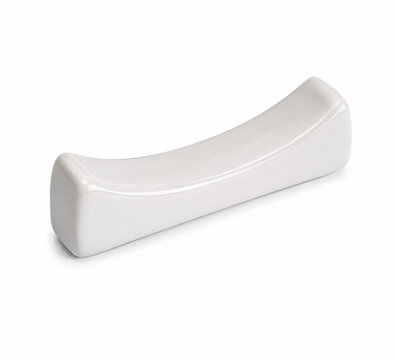 Close-up of modern white ceramic brush rest
