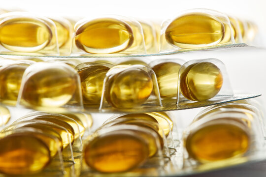 Golden fish oil omega 3 softgel capsules in blister packs