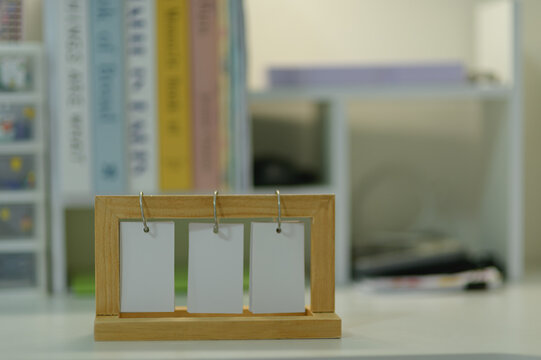 Wooden Photo Holder Frame with Three Blank Cards on Office Desk