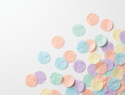 Scattered pastel paper circles form a cheerful, minimalist background for festive occasions. Soft colors create a delicate, playful design perfect for celebrations and invitations.