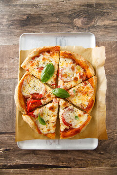 Homemade pizza with tomatoes and mozzarella cheese