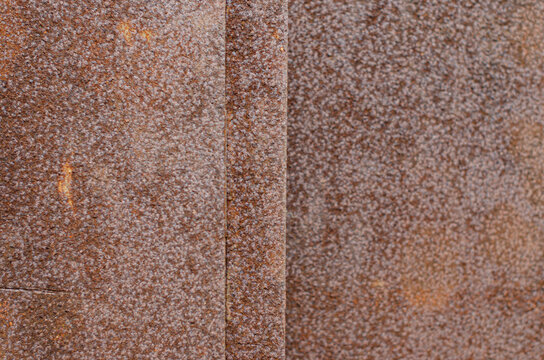 Heavily rusted steel plate on board an offshore support vessel. The metal shows extensive surface corrosion and uniform coating deterioration, indicating prolonged exposure to moisture and the marine.