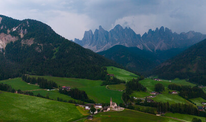 Obraz premium Landscape village Santa Maddalena in mountain valley at sunset in Dolomites, Italy. St. Magdalena and mountains. Val di Funes 