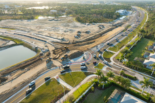 Industrial roadworks. Roundabout on wide American highway under construction. Development of transportation system for rapid transit