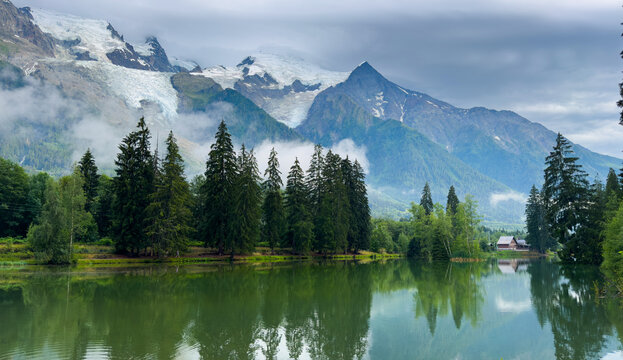 Idyllic landscape of Mont Blanc massif reflecting in Lac des Gaillands at Chamonix, France