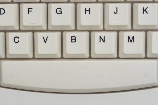 Close-up of white computer keyboard background