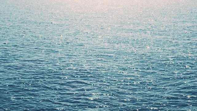 Sparkling sea waves and shimmering water surface, Slow motion