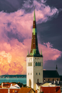 St. Olaf's Church spire and defensive walls under dramatic clouds