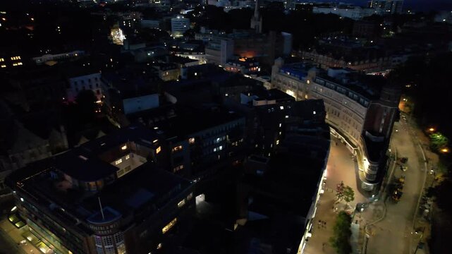 High Angle Night Footage of Illuminated Buildings and Roads with Traffic at Best Tourist Attraction Destination of England at Bournemouth City with Sandy Beach and Ocean of Great Britain, 