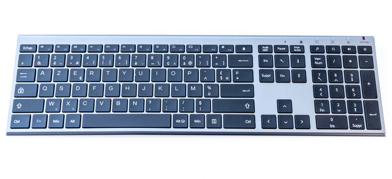 Fullsize silver and black AZERTY keyboard on a clean white surface