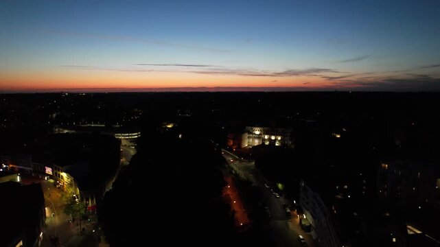 High Angle Night Footage of Illuminated Buildings and Roads with Traffic at Best Tourist Attraction Destination of England at Bournemouth City with Sandy Beach and Ocean of Great Britain, 