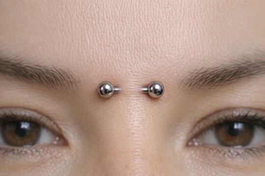 A close-up shot of a person's face featuring a nose piercing
