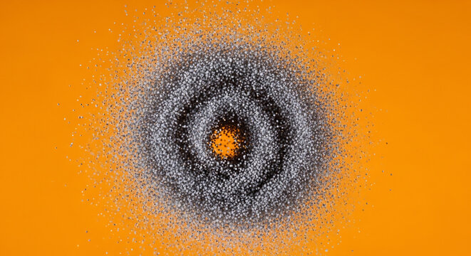 Dynamic swirling particles forming a dark vortex with a bright orange center on a vibrant orange background, suitable for abstract backgrounds, science concepts and motion graphics