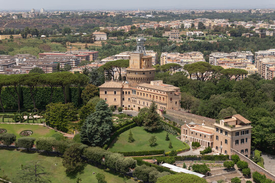 Vatican Gardens surround historic stone buildings in an aerial view.