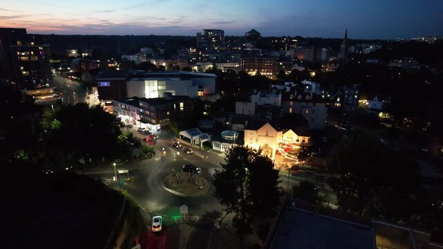 High Angle Night Footage of Illuminated Buildings and Roads with Traffic at Best Tourist Attraction Destination of England at Bournemouth City with Sandy Beach and Ocean of Great Britain, 