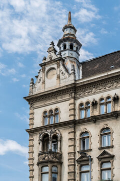 Historicist apartment building facade with a corner turret and carved balcony on Bajcsy Zsilinszky ut in Budapest