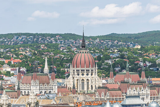 Hungarian Parliament building's dome and spires seen from the terrace of Saint Stephen's Basilica in Budapest