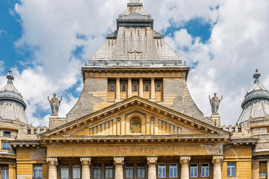 Pediment, columns and central rooftop tower of Anker Palace in the Terezvaros district of Budapest, Hungary