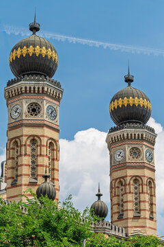 Twin clock towers and patterned onion domes of Dohany Street Synagogue in the Erzsebetvaros district of Budapest, Hungary