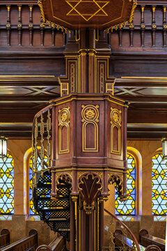 Carved wooden pulpit and spiral staircase inside Dohany Street Synagogue in the Erzsebetvaros district of Budapest, Hungary