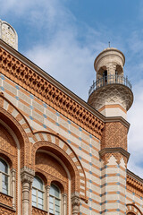 Historic minaret-like corner turret and patterned facade of Rumbach Street Synagogue in Budapest, Hungary © GuillaumeAngleraud
