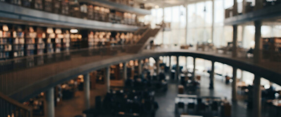 Fototapeta premium Modern Library Interior Fully Blurred Academic Study Space With Shelving Desks Soft Natural Light And Spacious Background For Education Publishing Research And Professional Design Projects