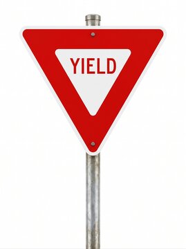 Isolated frontal view of a yield road sign on a metal pole.